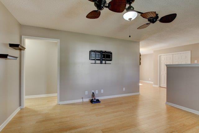 421 Woodale Dr, Clarksville, TN 37042 - unfurnished room with a ceiling fan, a textured ceiling, and wood finished floors