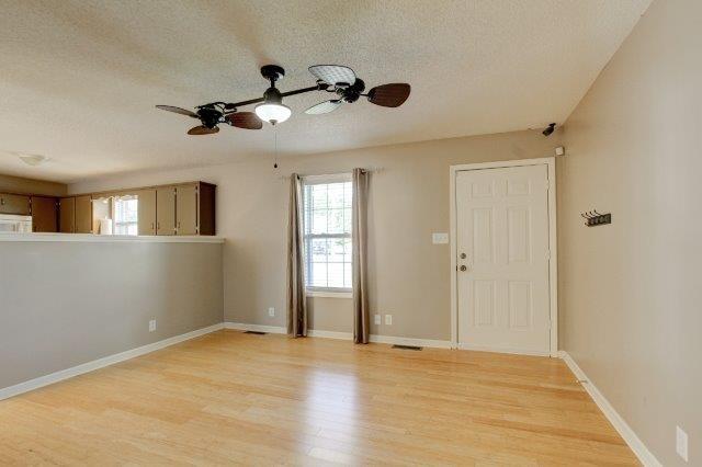 421 Woodale Dr, Clarksville, TN 37042 - entryway featuring a textured ceiling, healthy amount of natural light, ceiling fan, and light wood-type flooring