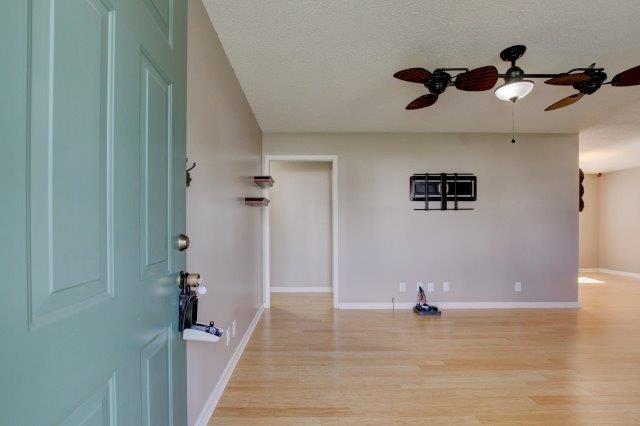 421 Woodale Dr, Clarksville, TN 37042 - foyer entrance with a ceiling fan, light wood-style floors, and a textured ceiling