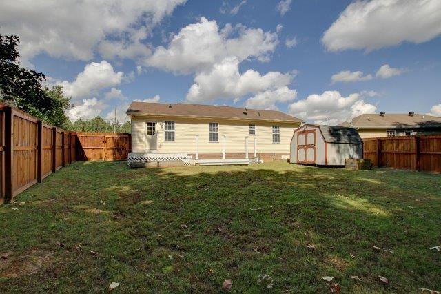 421 Woodale Dr, Clarksville, TN 37042 - rear view of house featuring a shed and a fenced backyard