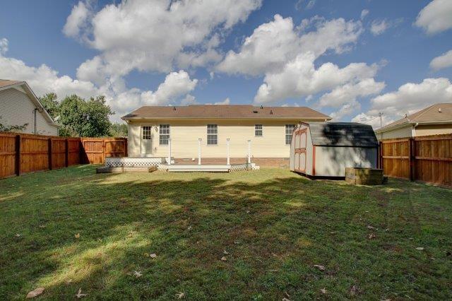 421 Woodale Dr, Clarksville, TN 37042 - rear view of house featuring a shed, a fenced backyard, and a wooden deck