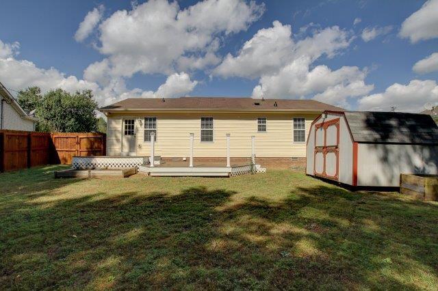 421 Woodale Dr, Clarksville, TN 37042 - rear view of house with a shed, a deck, and a fenced backyard