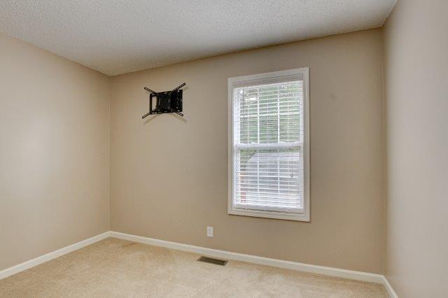 421 Woodale Dr, Clarksville, TN 37042 - unfurnished room featuring light colored carpet and a textured ceiling
