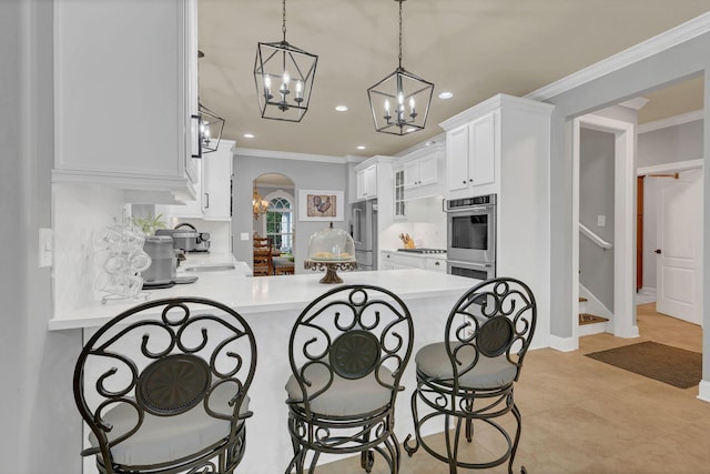 2005 Windsong Dr, Spring Hill, TN 37174 - kitchen featuring stainless steel appliances, recessed lighting, a breakfast bar, a peninsula, and a chandelier
