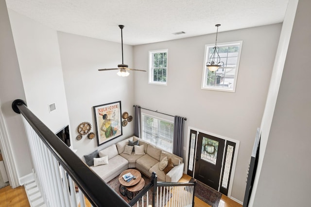 3232 Dark Woods Dr, Franklin, TN 37064 - living room featuring light wood-style floors, a high ceiling, and a ceiling fan