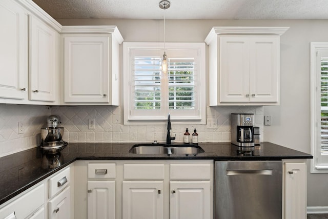 3232 Dark Woods Dr, Franklin, TN 37064 - kitchen featuring stainless steel dishwasher, white cabinetry, backsplash, and a textured ceiling