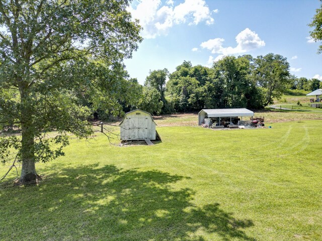 1843 Clara Mathis Rd, Spring Hill, TN 37174 - view of grassy yard with a carport, a shed, and view of scattered trees