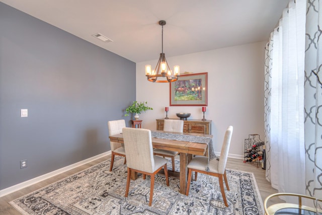 207 Welara St, Murfreesboro, TN 37129 - dining room with a chandelier and light wood-type flooring