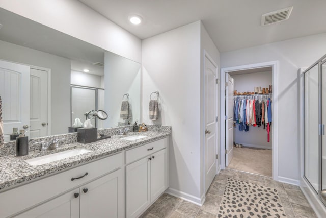 207 Welara St, Murfreesboro, TN 37129 - bathroom with a stall shower, double vanity, and a spacious closet