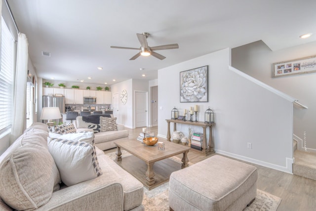 207 Welara St, Murfreesboro, TN 37129 - living room featuring a ceiling fan, light wood-style flooring, stairway, and recessed lighting