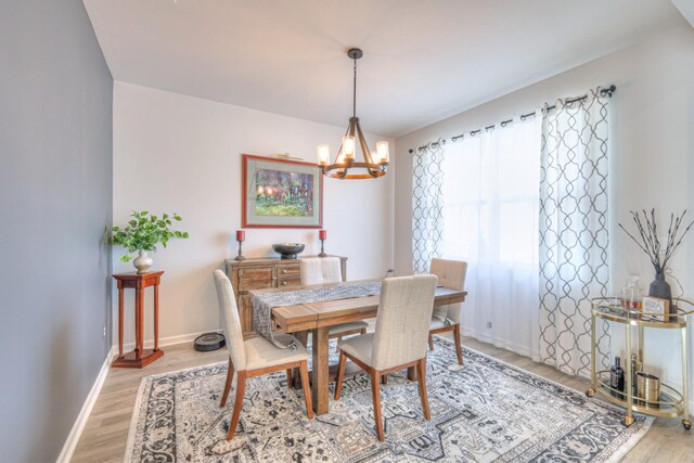 207 Welara St, Murfreesboro, TN 37129 - dining room featuring light wood-type flooring and a chandelier