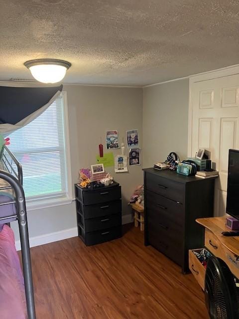 117 Willow St N, Cowan, TN 37318 - bedroom with a textured ceiling and wood finished floors