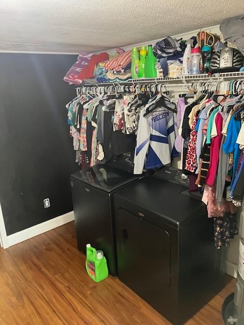117 Willow St N, Cowan, TN 37318 - spacious closet featuring separate washer and dryer and wood finished floors