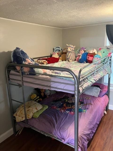 117 Willow St N, Cowan, TN 37318 - bedroom with wood finished floors and a textured ceiling