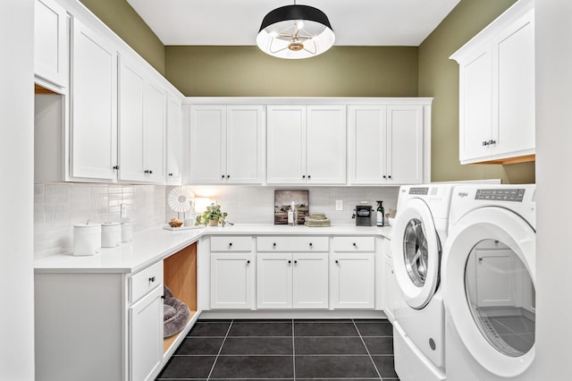 7405 Leelee Dr, Franklin, TN 37064 - laundry area with cabinet space, washing machine and clothes dryer, and dark tile patterned flooring