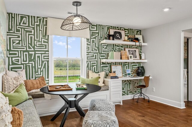7405 Leelee Dr, Franklin, TN 37064 - dining space featuring an accent wall, wallpapered walls, dark wood-style flooring, and an office area