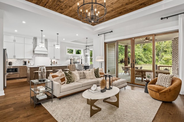 7405 Leelee Dr, Franklin, TN 37064 - living room with a tray ceiling, recessed lighting, a chandelier, dark wood-style flooring, and wooden ceiling