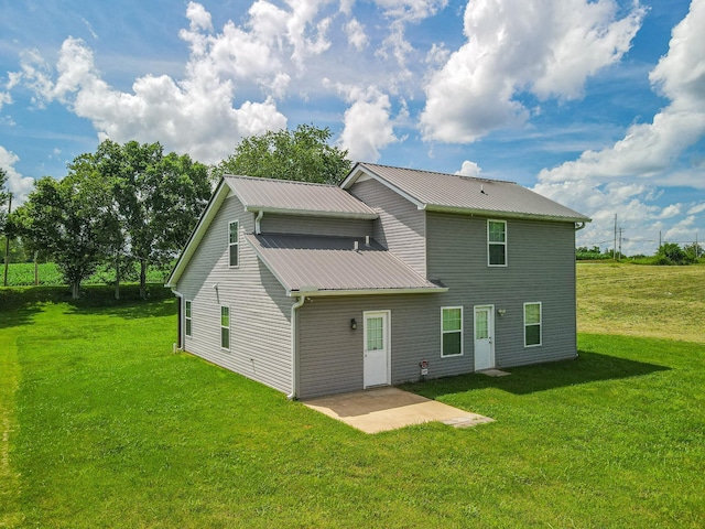 109 Tindell Ln, Columbia, TN 38401 - rear view of house with a yard, a metal roof, and a patio