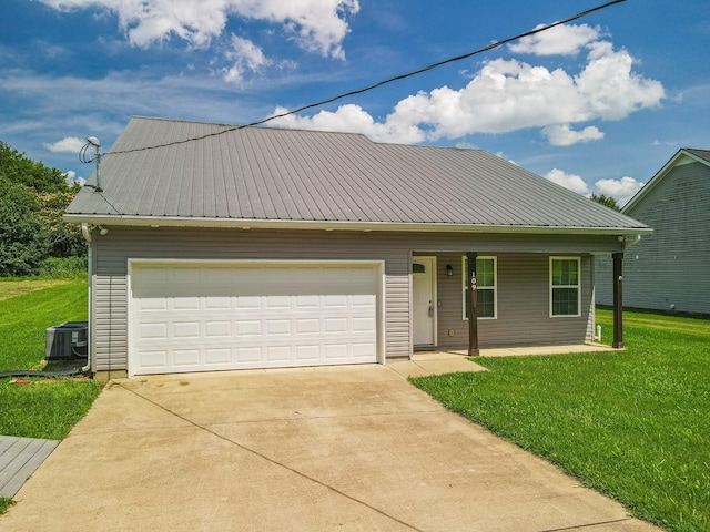 109 Tindell Ln, Columbia, TN 38401 - view of front of home with a front yard, driveway, an attached garage, a metal roof, and a porch