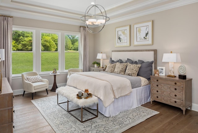 7243 Murrel Dr, Franklin, TN 37064 - bedroom with a tray ceiling, crown molding, multiple windows, a chandelier, and wood finished floors