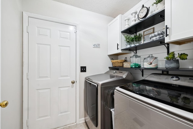 3114 Penny Ln, Murfreesboro, TN 37130 - laundry area with cabinet space, independent washer and dryer, and a textured ceiling