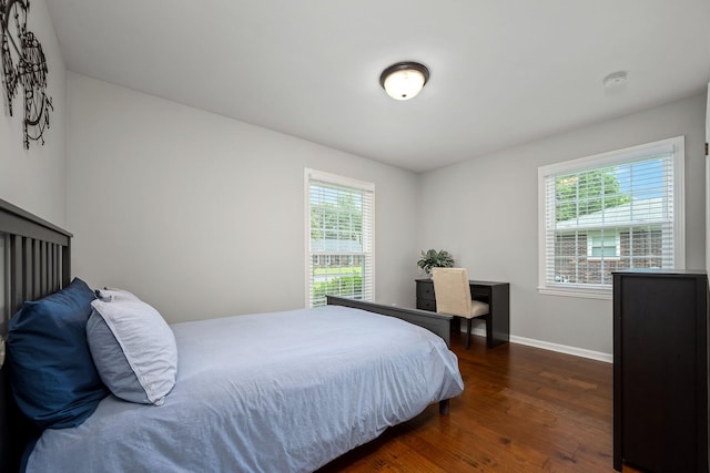 1002 Sunset Ave, Murfreesboro, TN 37129 - bedroom featuring multiple windows and dark wood finished floors