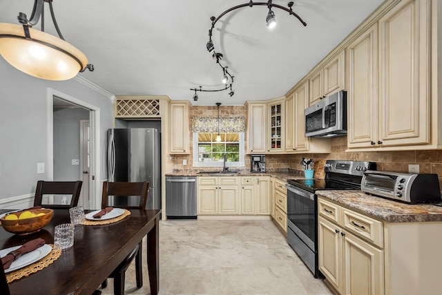 1002 Sunset Ave, Murfreesboro, TN 37129 - kitchen featuring cream cabinets, appliances with stainless steel finishes, and tasteful backsplash