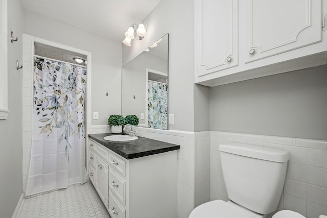 1002 Sunset Ave, Murfreesboro, TN 37129 - bathroom with vanity, tile walls, wainscoting, and curtained shower