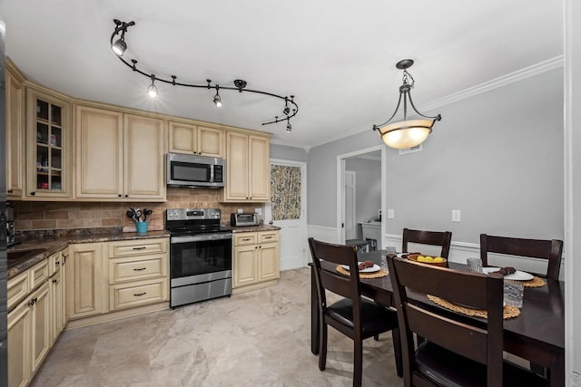1002 Sunset Ave, Murfreesboro, TN 37129 - kitchen with appliances with stainless steel finishes, cream cabinetry, tasteful backsplash, glass insert cabinets, and ornamental molding