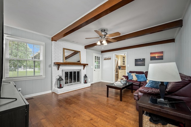 1002 Sunset Ave, Murfreesboro, TN 37129 - living area with beam ceiling, wood finished floors, ceiling fan, a brick fireplace, and crown molding