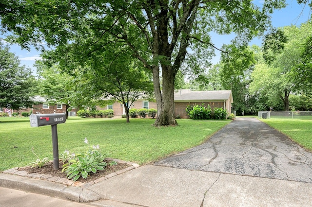 1002 Sunset Ave, Murfreesboro, TN 37129 - ranch-style house with brick siding and asphalt driveway