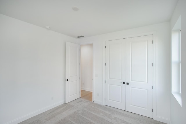 2359 Williamsport Lndg, Columbia, TN 38401 - unfurnished bedroom featuring light carpet and a closet