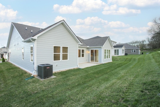 2359 Williamsport Lndg, Columbia, TN 38401 - rear view of house with a yard, a patio area, and roof with shingles