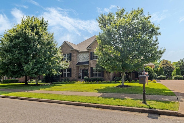 4024 Campania Strada, Spring Hill, TN 37174 - view of front of home with a front yard and brick siding