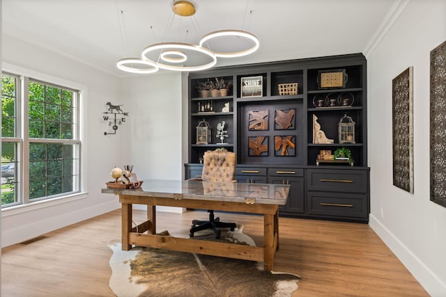 4024 Campania Strada, Spring Hill, TN 37174 - home office featuring ornamental molding, light wood-style floors, and a chandelier
