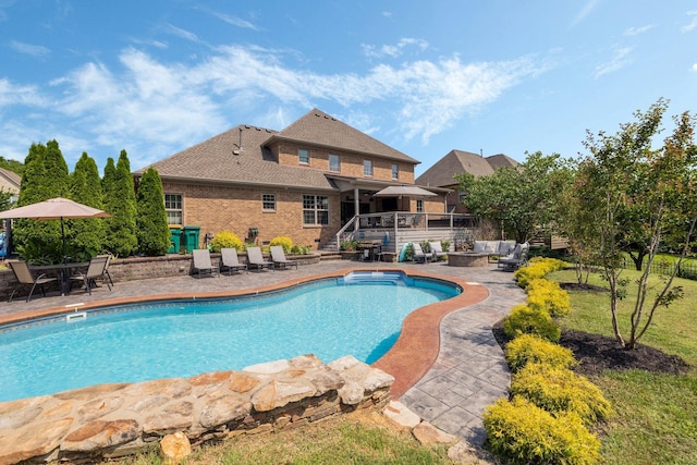 4024 Campania Strada, Spring Hill, TN 37174 - outdoor pool featuring a patio, a wooden deck, stairs, and a fire pit