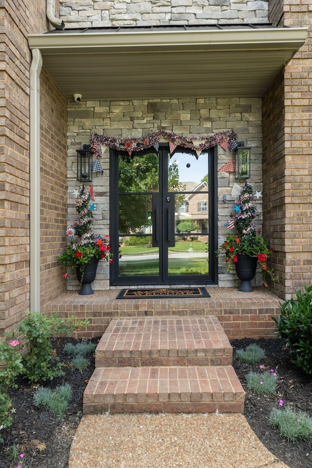 4024 Campania Strada, Spring Hill, TN 37174 - entrance to property with french doors, a security system, and brick siding