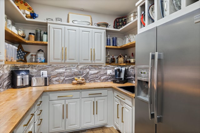 4024 Campania Strada, Spring Hill, TN 37174 - kitchen featuring stainless steel refrigerator with ice dispenser, open shelves, and wood counters
