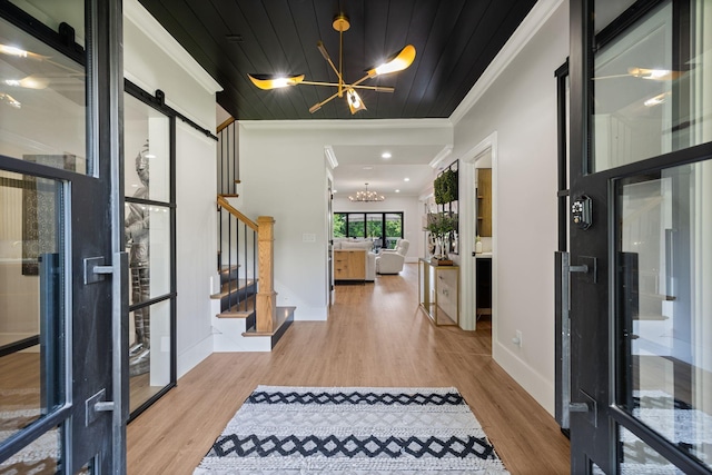 4024 Campania Strada, Spring Hill, TN 37174 - entryway featuring a chandelier, ornamental molding, stairway, wood finished floors, and wooden ceiling