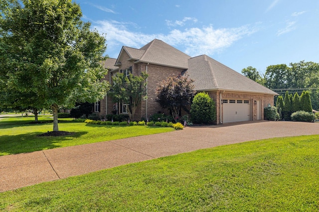 4024 Campania Strada, Spring Hill, TN 37174 - view of front of house featuring brick siding, an attached garage, a front lawn, and concrete driveway