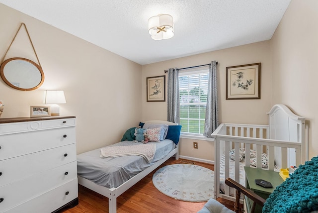 178 Miranda Rd, Cadiz, KY 42211 - bedroom featuring wood finished floors and a textured ceiling