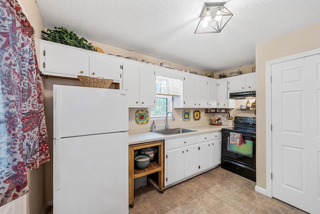 178 Miranda Rd, Cadiz, KY 42211 - kitchen with freestanding refrigerator, black range with electric cooktop, under cabinet range hood, a textured ceiling, and white cabinetry