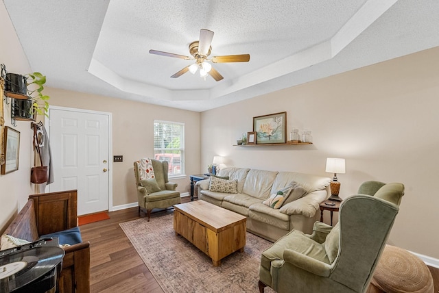 178 Miranda Rd, Cadiz, KY 42211 - living area with a raised ceiling, a ceiling fan, a textured ceiling, and light wood-style floors