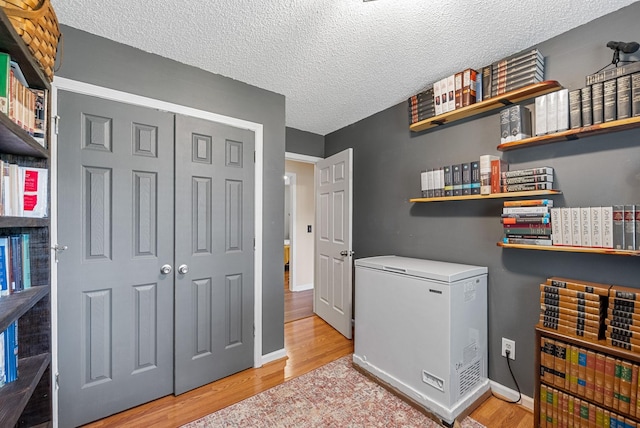 178 Miranda Rd, Cadiz, KY 42211 - washroom with light wood finished floors and a textured ceiling