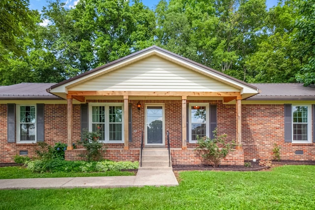 116 Skyview Dr, Columbia, TN 38401 - view of front of property featuring a front yard, brick siding, and a metal roof