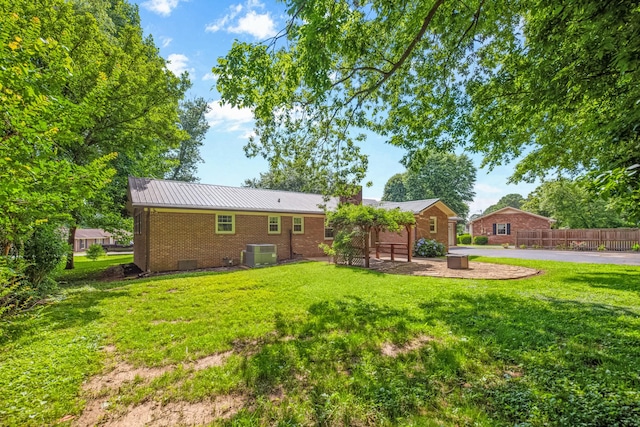 116 Skyview Dr, Columbia, TN 38401 - rear view of property with brick siding, a metal roof, and a patio