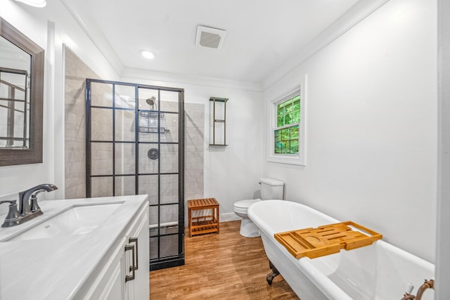 116 Skyview Dr, Columbia, TN 38401 - bathroom featuring a freestanding bath, a shower stall, vanity, wood finished floors, and ornamental molding