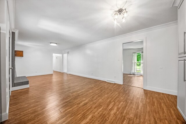116 Skyview Dr, Columbia, TN 38401 - unfurnished living room with wood finished floors and crown molding