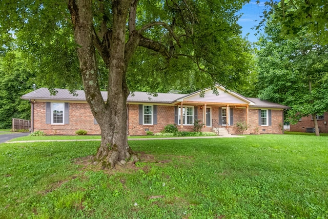 116 Skyview Dr, Columbia, TN 38401 - single story home featuring a front yard, brick siding, and a porch
