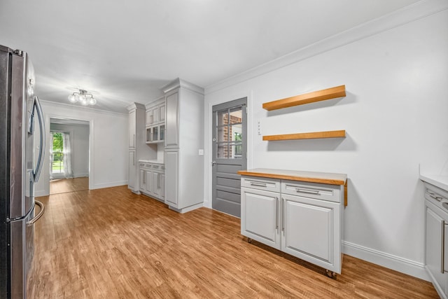 116 Skyview Dr, Columbia, TN 38401 - kitchen featuring freestanding refrigerator, crown molding, light wood finished floors, and open shelves